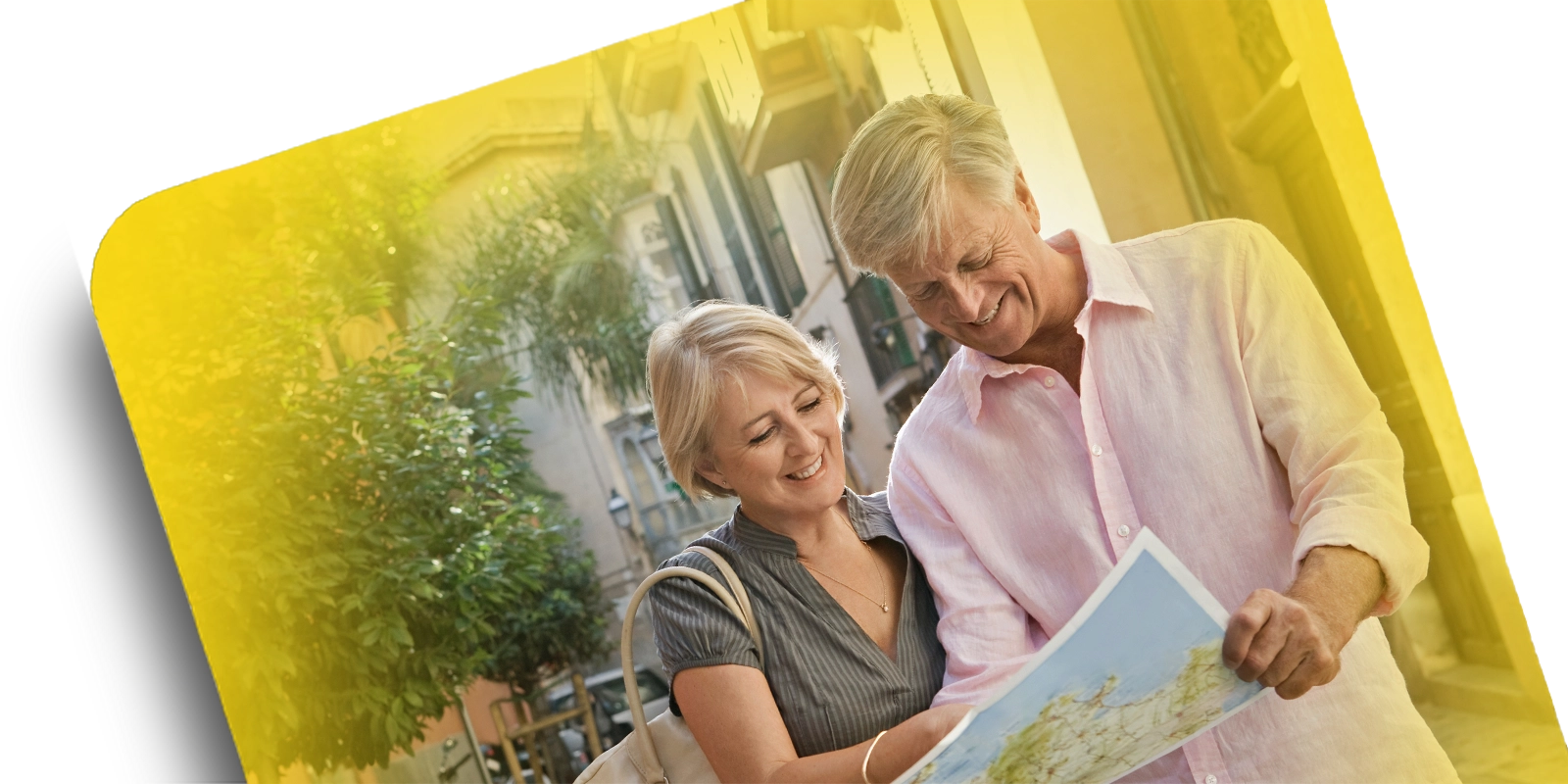 woman and man looking at a map and smiling